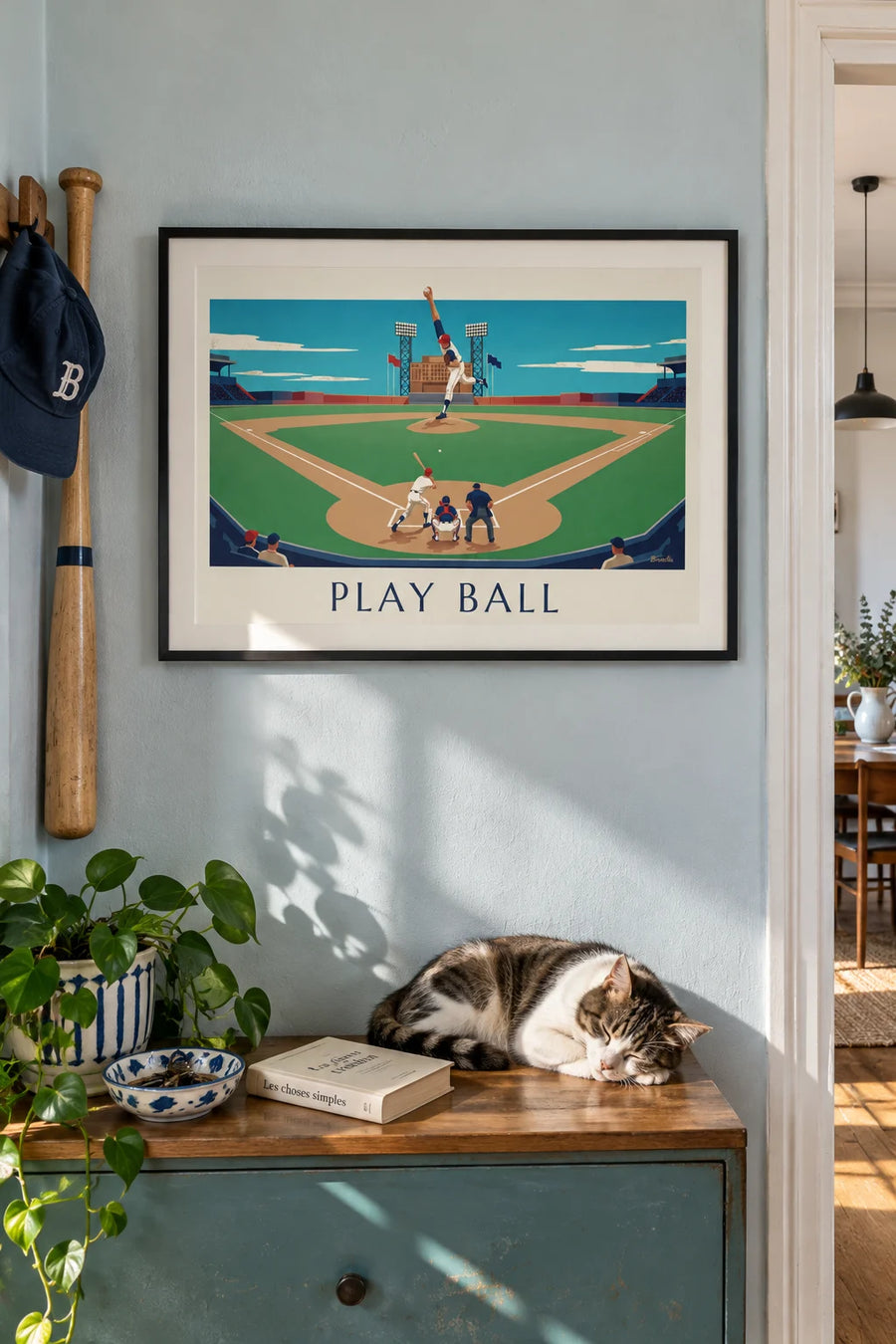 Poster of a baseball game seen from the stands on an afternoon: framed on the wall