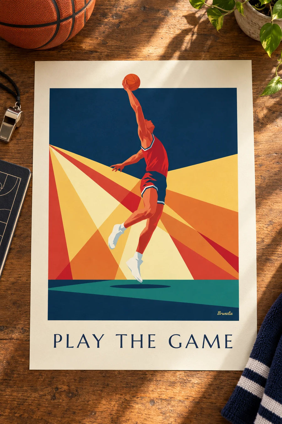 Affiche joueur de basketball en plein dunk sur fond de rayons : posée sur une table