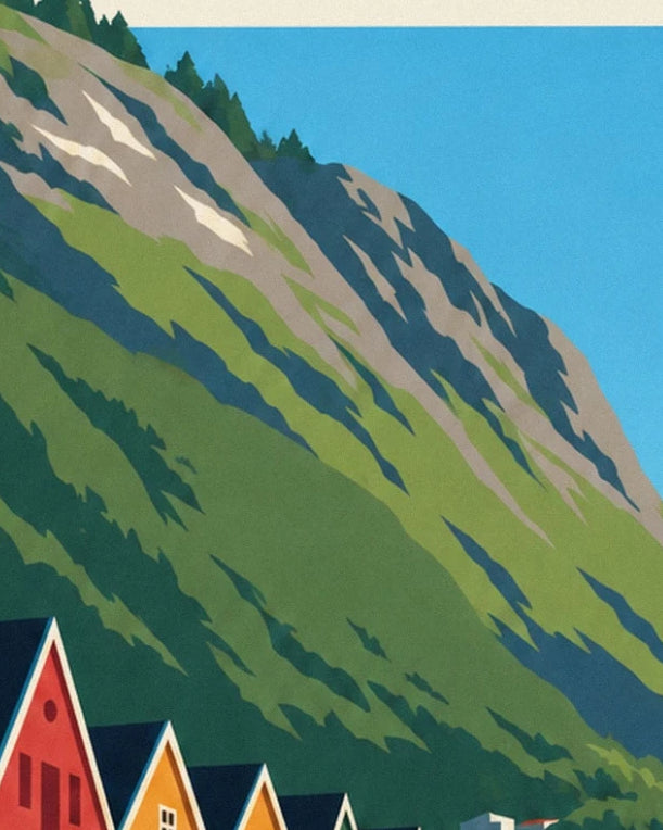 The rocky green slope above the pointed rooftops beneath a blue sky