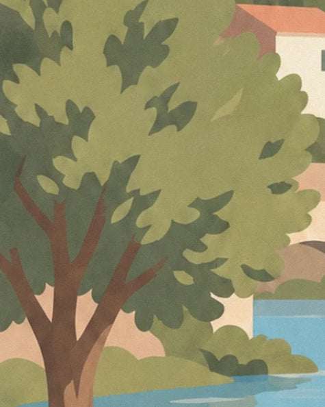 Un arbre au feuillage vert et au tronc brun devant les maisons et l’eau bleue