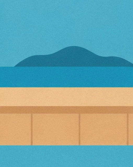 Le comptoir couleur sable face au lagon turquoise et à une île en silhouette
