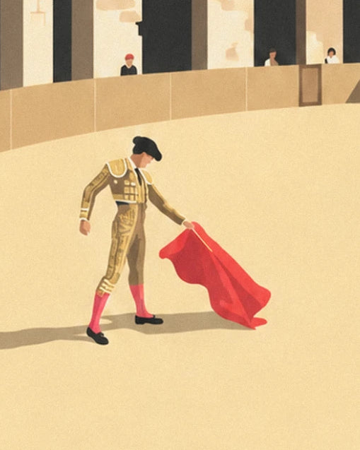 The matador in a golden suit with his red cape, alone on the sand of the arena