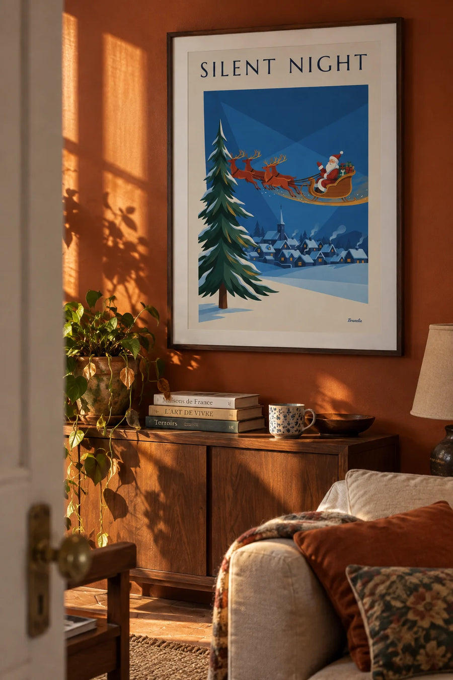 Affiche Père Noël sur son traîneau au-dessus d'un village enneigé : encadrée au mur