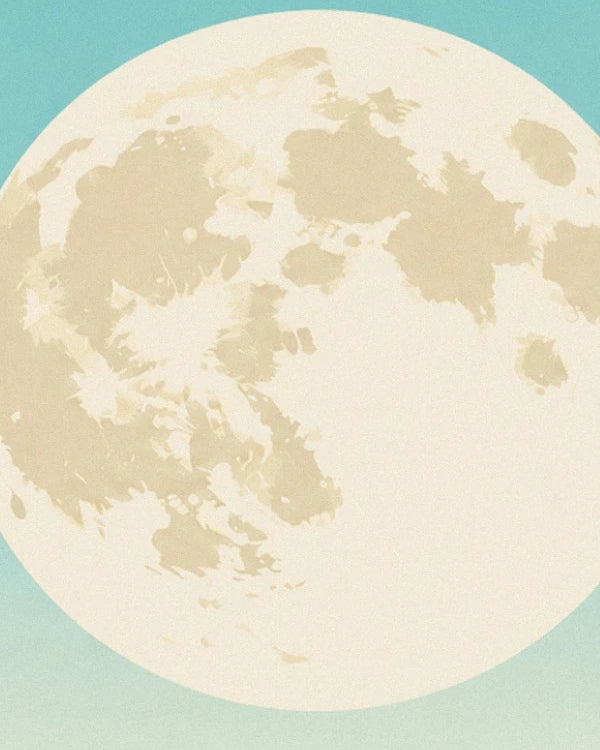 A giant moon with cream and beige craters against a turquoise sky