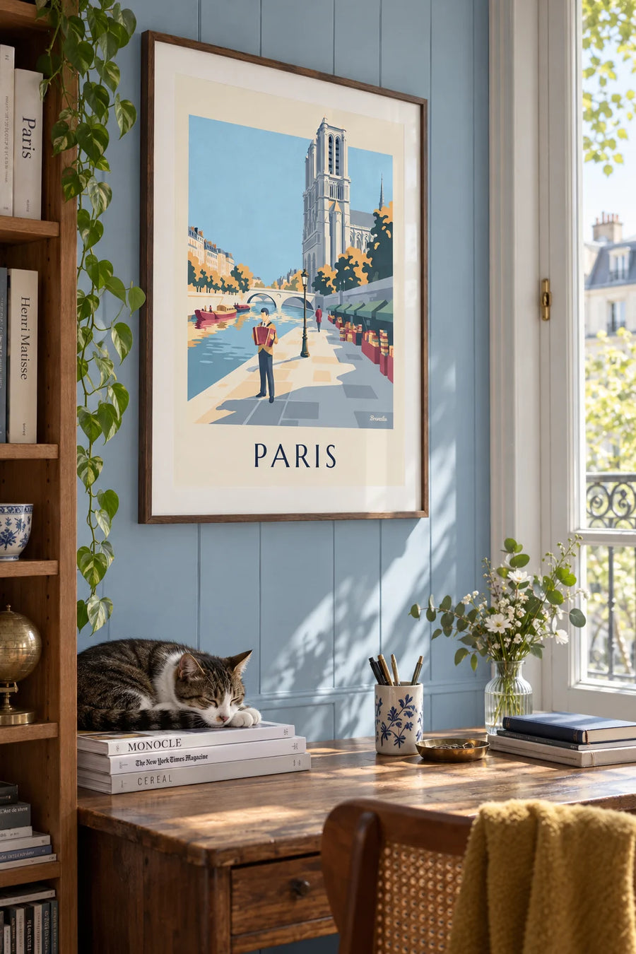 Poster of an accordionist on a quay along the Seine in Paris: framed on the wall