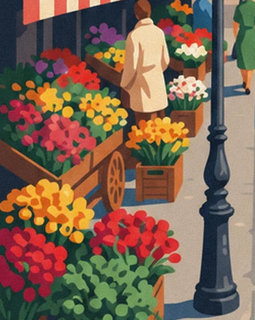 The flower seller's red and yellow bouquets beside the black street lamp