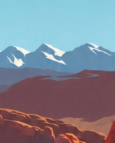 The blue-tinged mountains with snowy peaks behind the red rocks of Utah