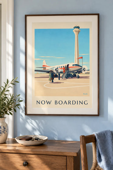 Poster of passengers boarding a propeller plane: framed on the wall