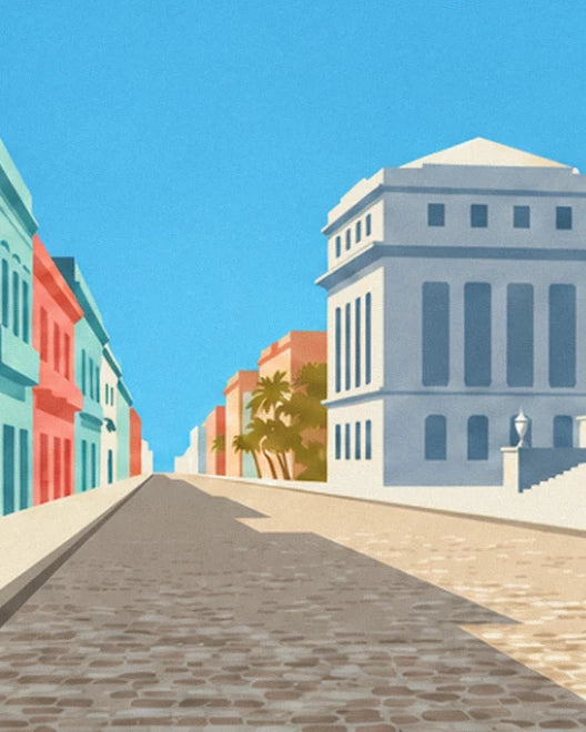 The cobbled street lined with turquoise and coral façades, with the Capitole on the right