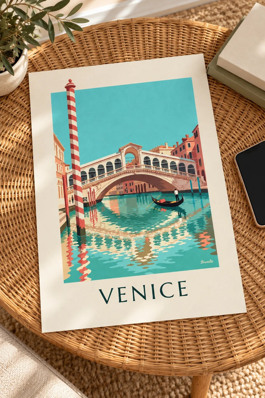 Rialto Bridge and gondola on Venice’s Grand Canal poster: laid flat on a table