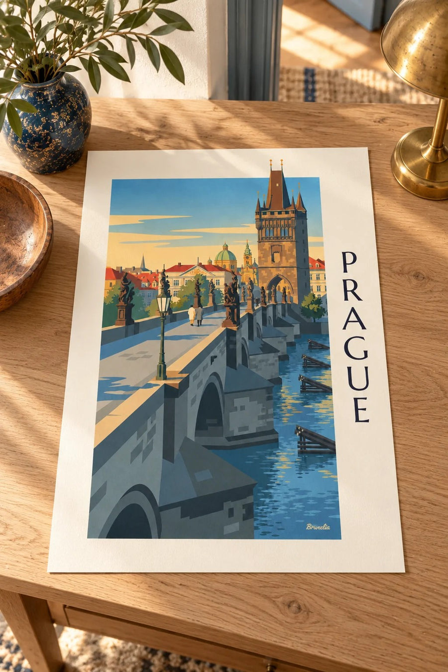 Prague Charles Bridge and Gothic tower on the Vltava poster: resting on a table