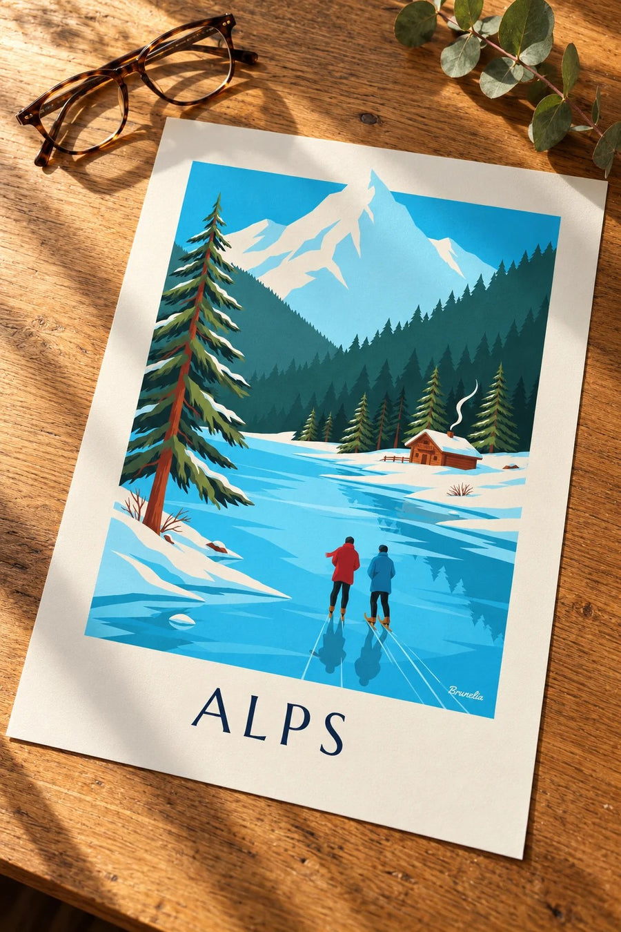 Skaters on a frozen lake below snowy Alps poster: laid flat on a table