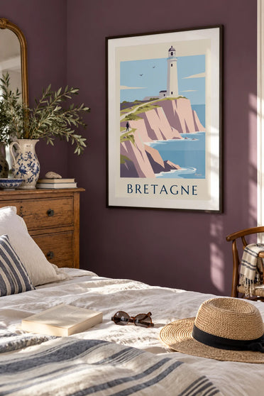 Poster of a white lighthouse atop the pink cliffs of the Brittany coast: framed on the wall