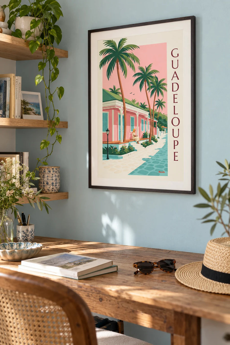 Poster of a pink Creole house under coconut palms in Guadeloupe: framed on the wall