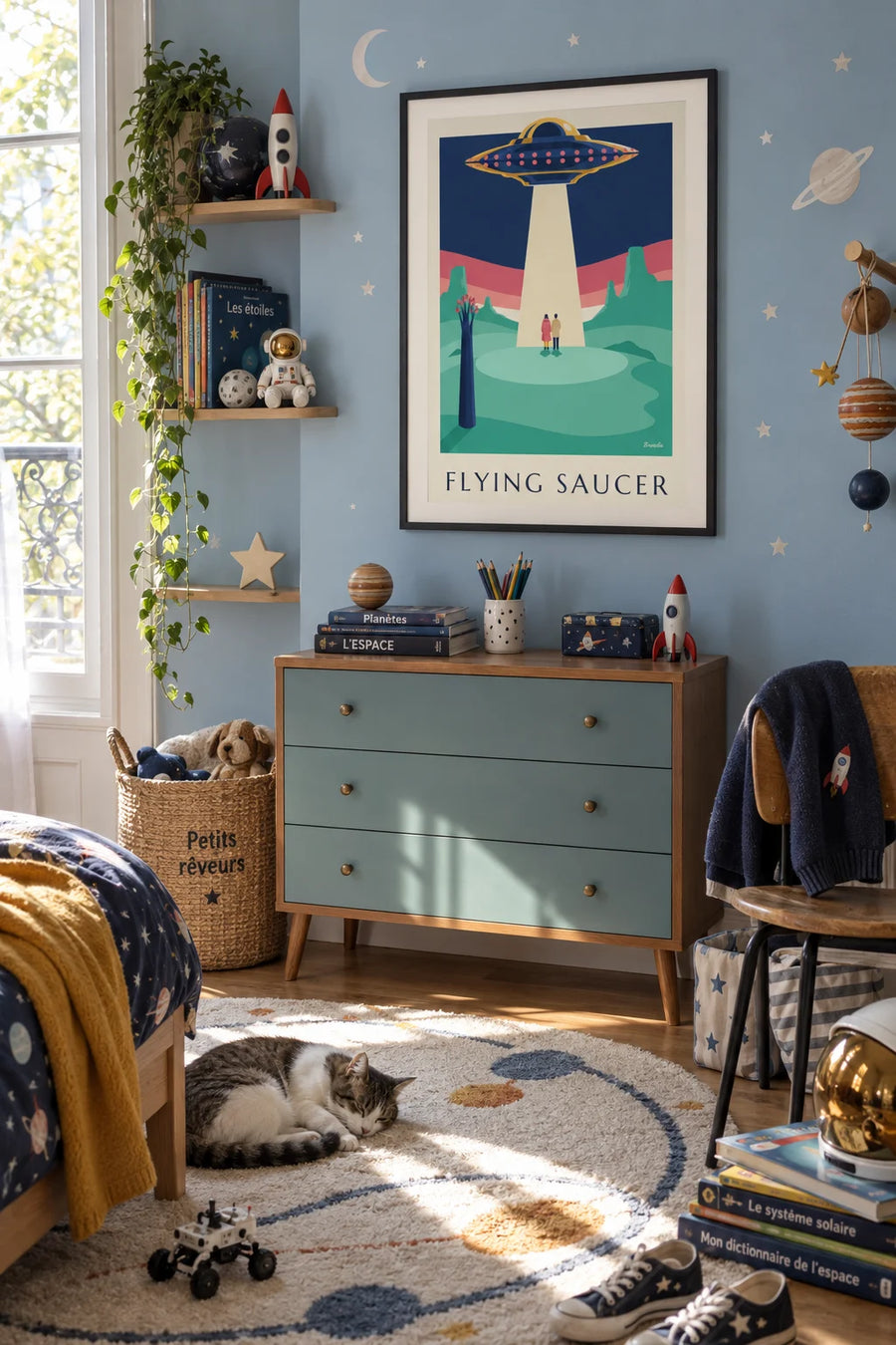 Poster of a flying saucer above a pastel planet: framed on the wall
