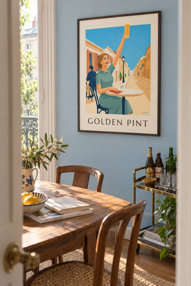 Poster of a smiling woman raising a glass of beer on a terrace: framed on the wall